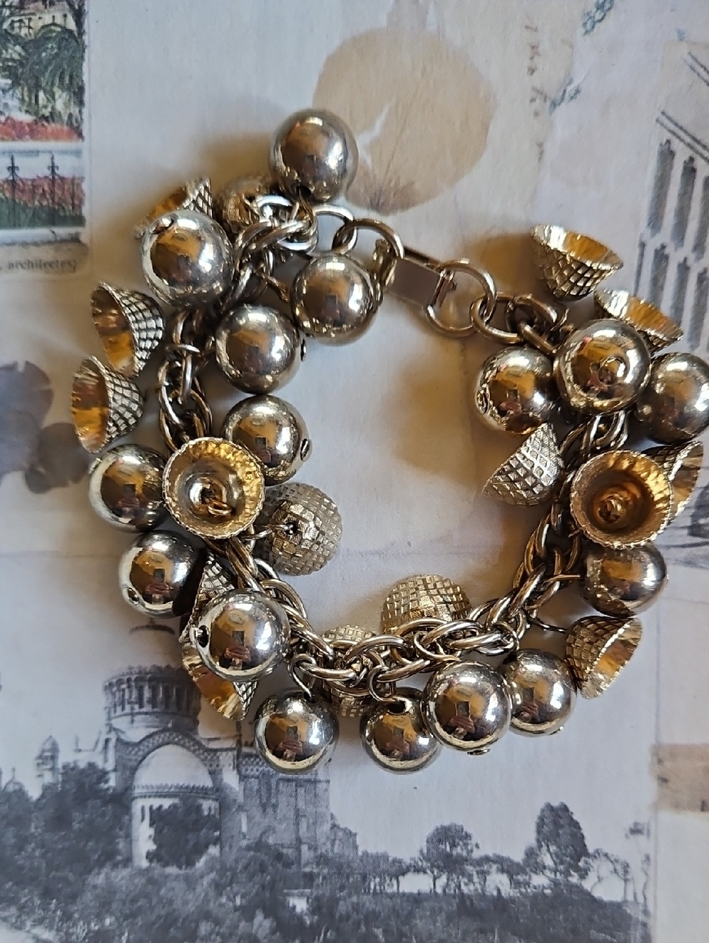 Chunky Gold-Tone Charm Bracelet with Textured Accents Balls, Bells Or Acorn Tops - Picture 2 of 5